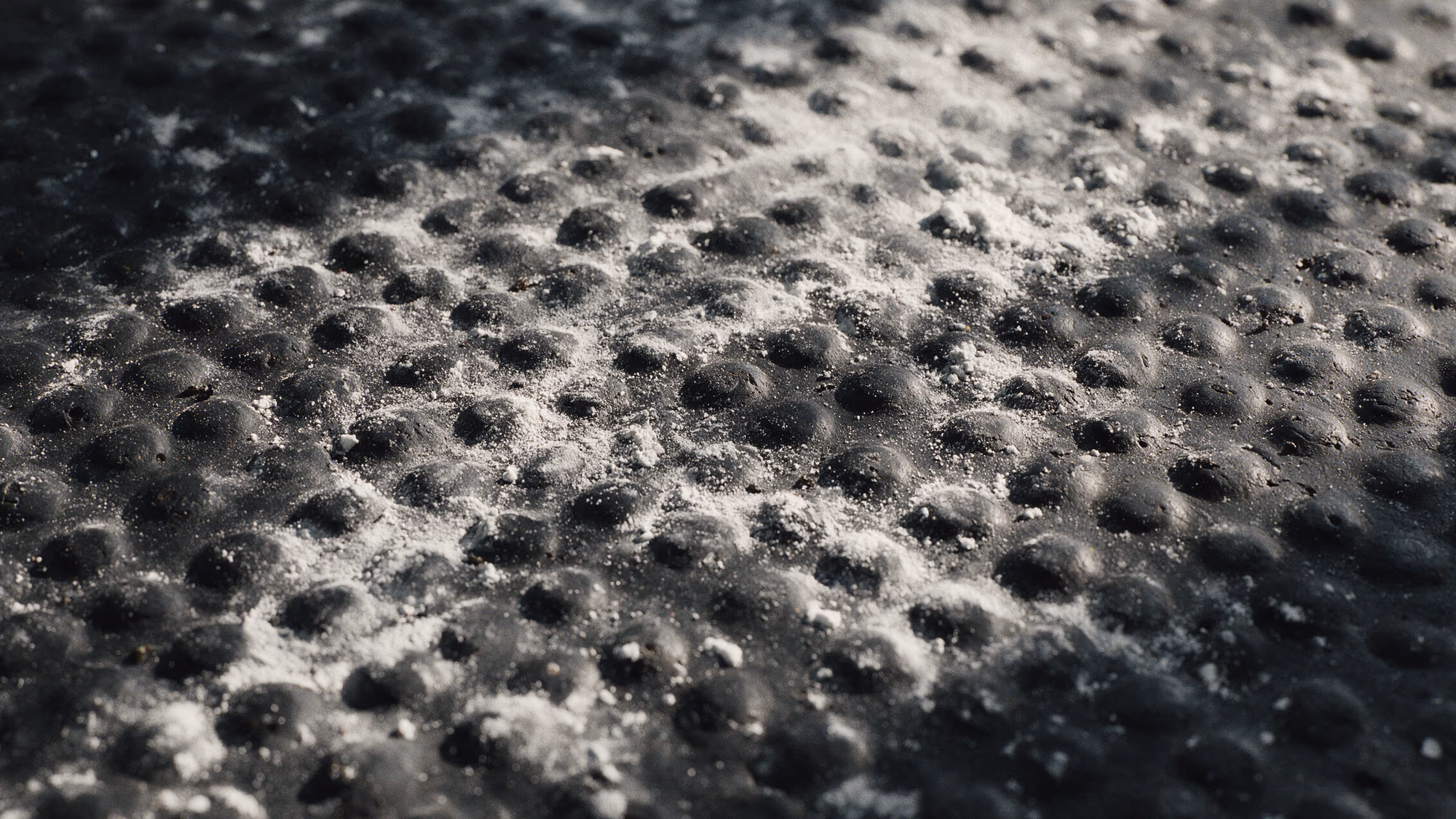 Chalk dust worked into a rubber training floor