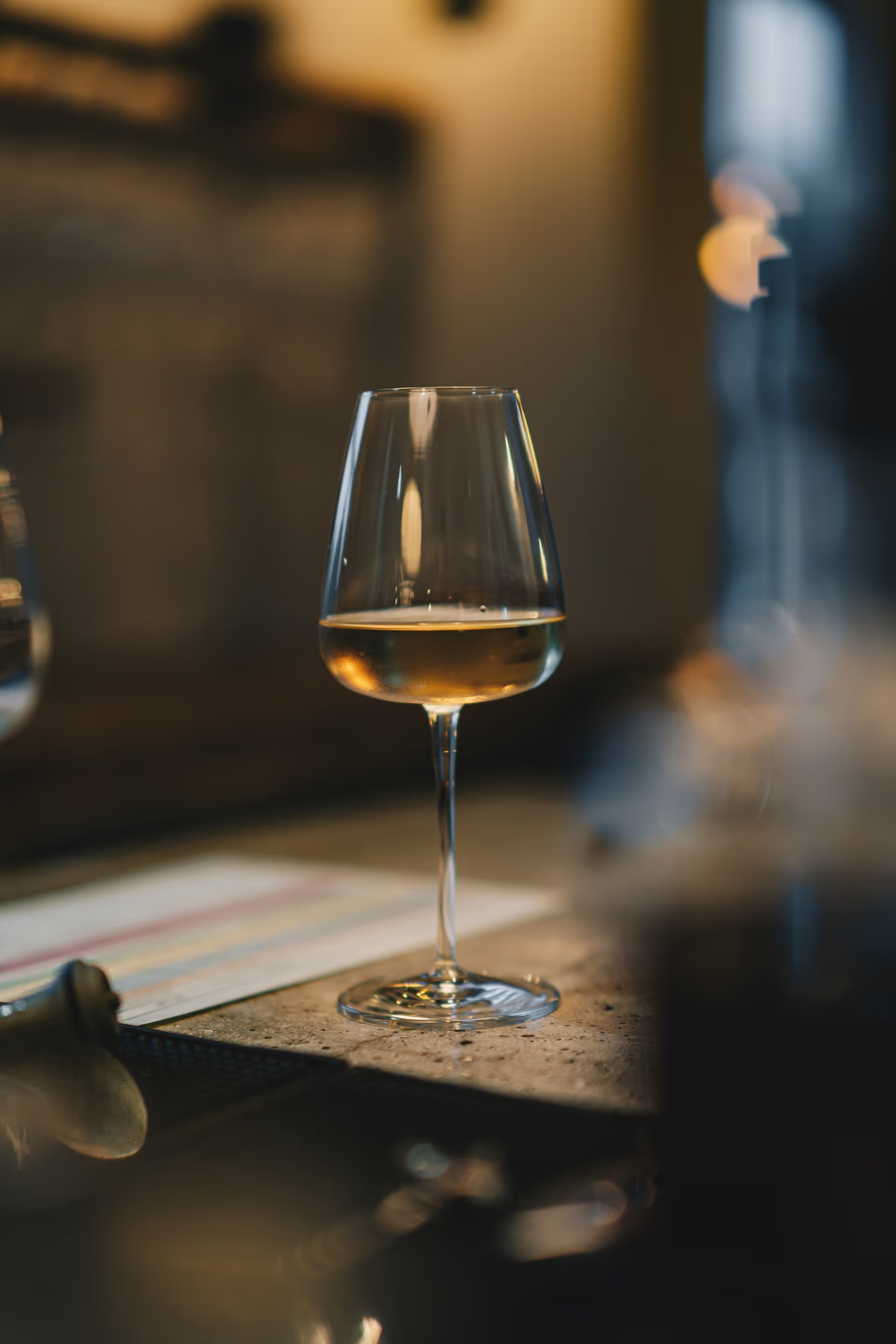 Wine glasses in amber light