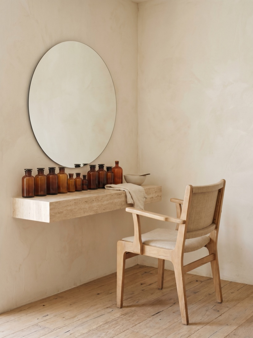 A bright, considered salon space with a single styling chair in soft daylight