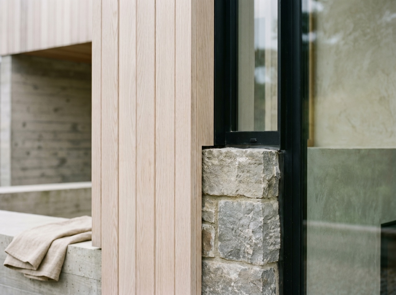 A close detail of timber and stone joinery on a new build