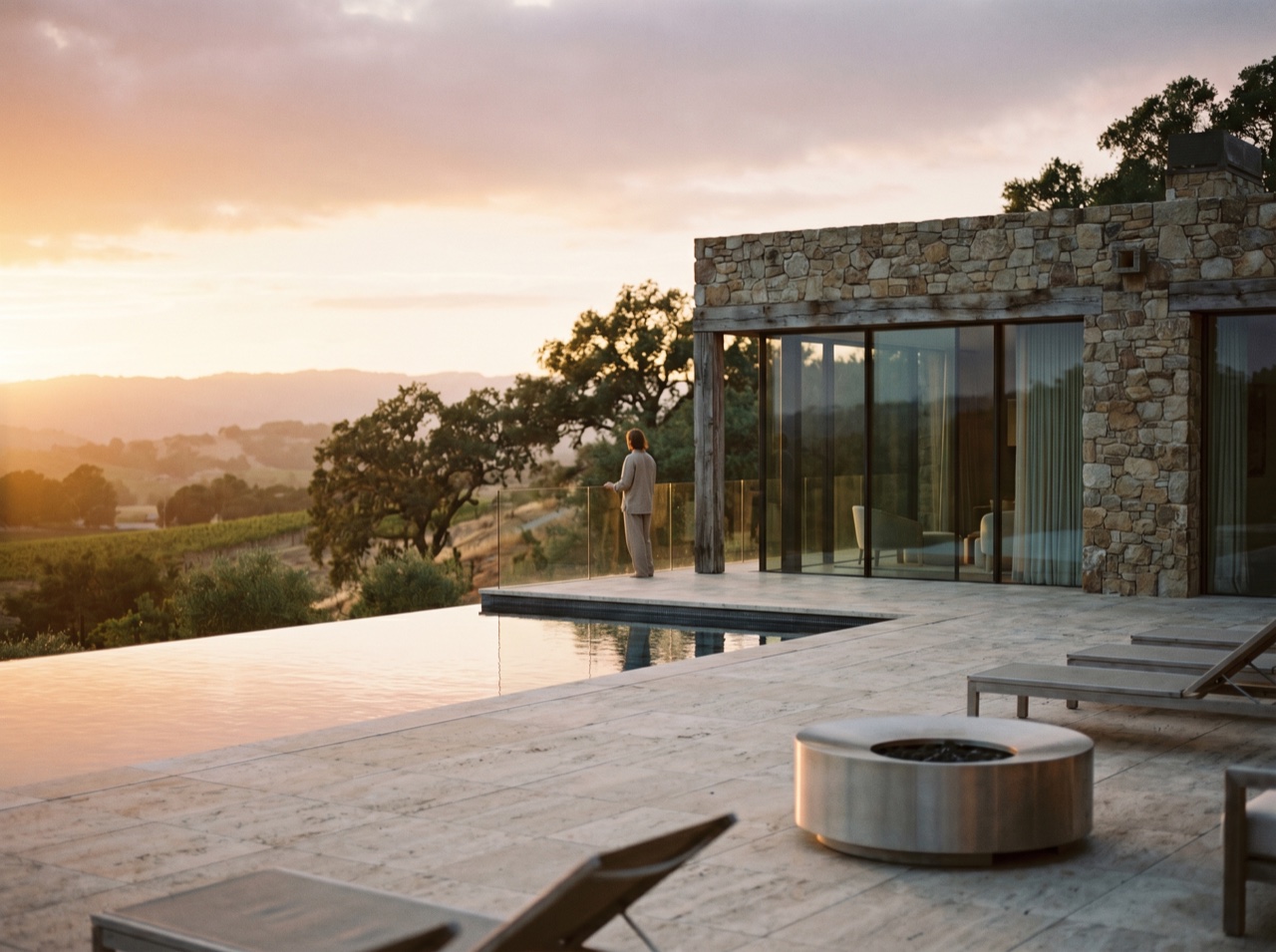 An infinity pool and terrace at golden hour, the estate's outlook